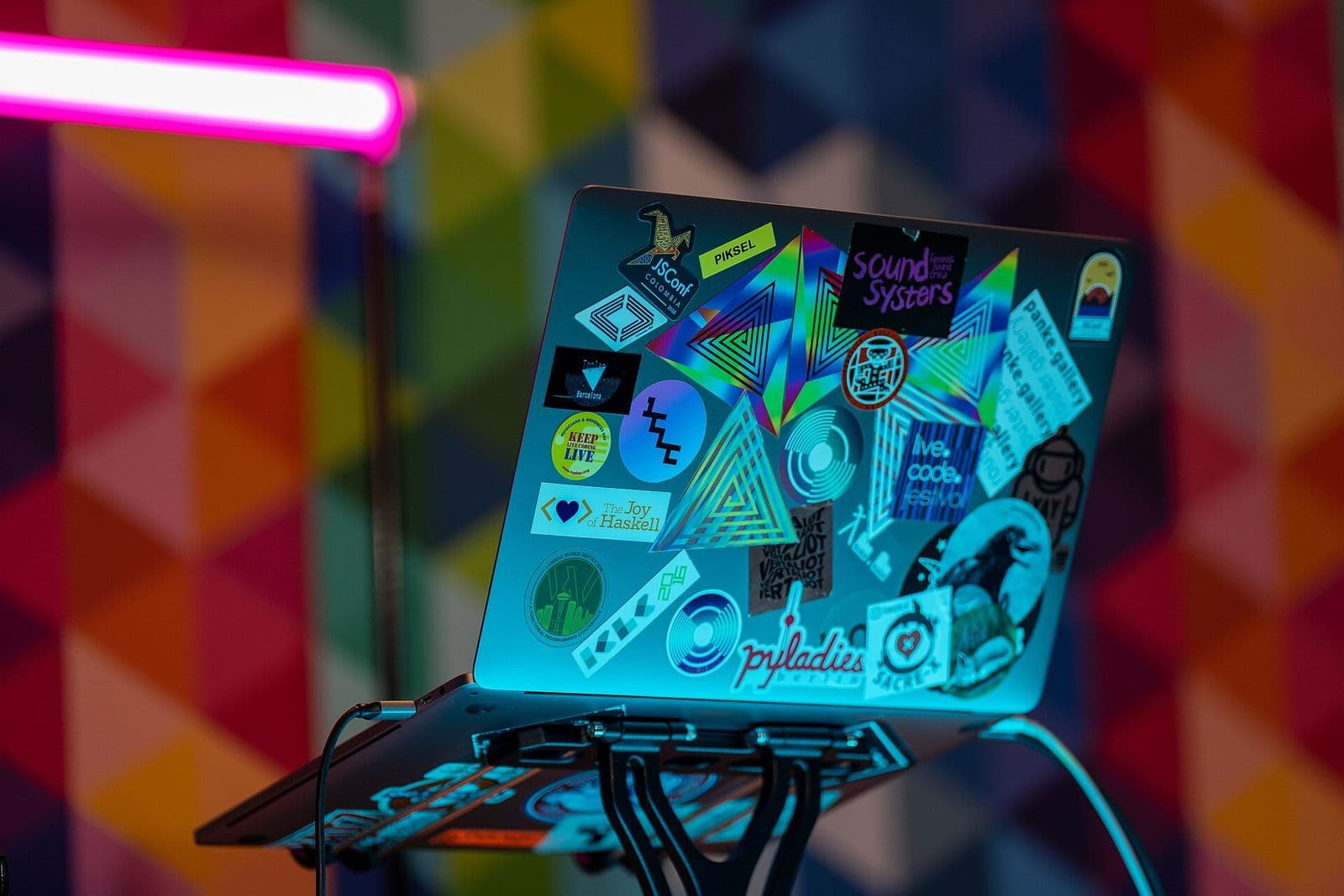 A sticker-covered laptop at the DrupalCon Prague 2022 reception